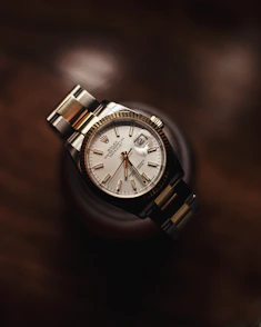 silver and white round analog watch