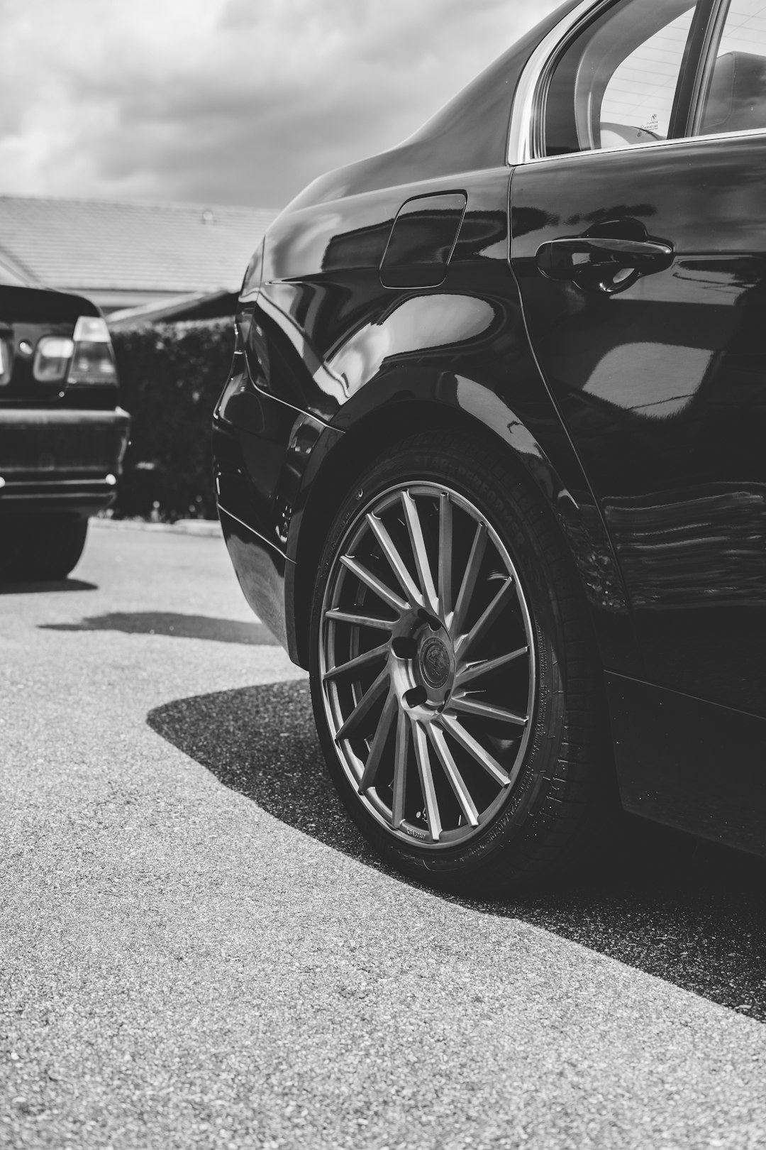 grayscale photo of car on road