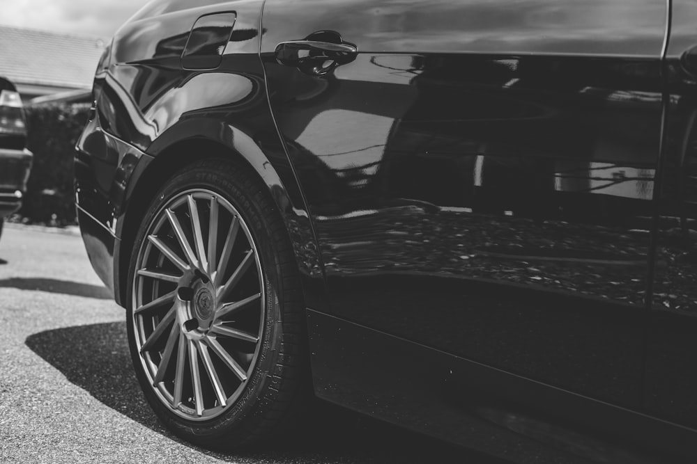 grayscale photo of car on road