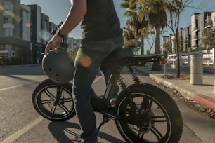 man in black t-shirt riding black motorcycle
