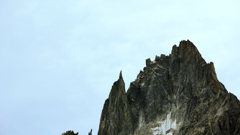 gray rocky mountain under white sky during daytime