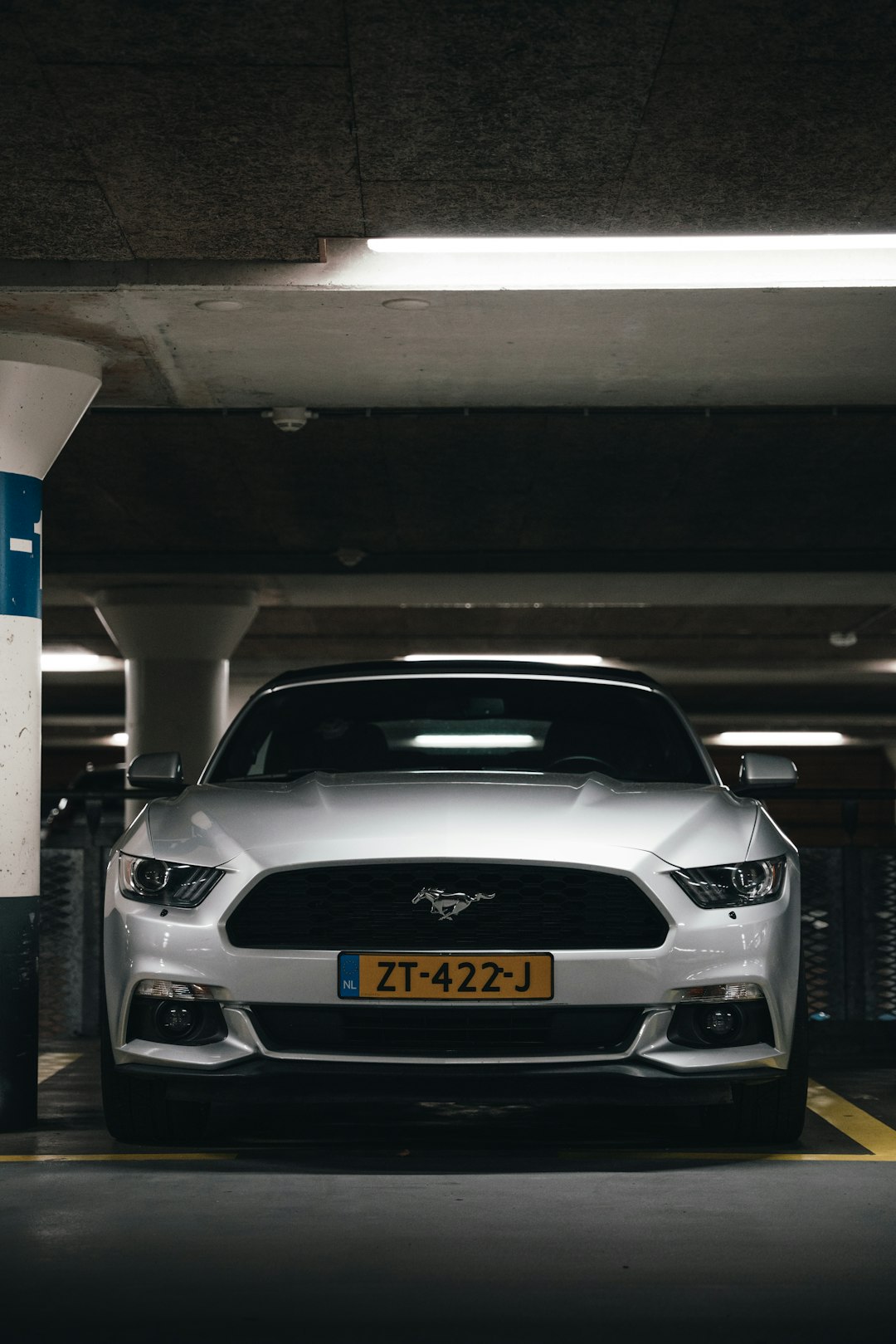 white bmw m 3 parked on garage