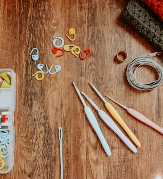 silver and gold rings on brown wooden table