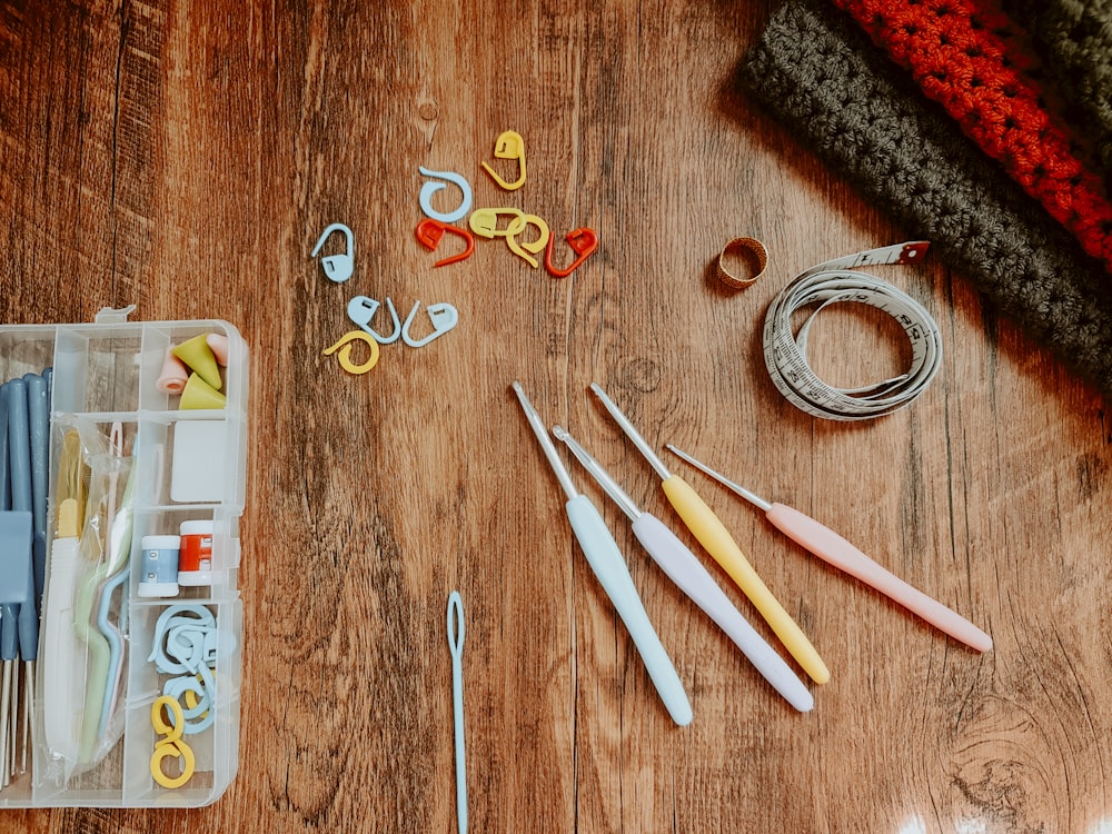 silver and gold rings on brown wooden table