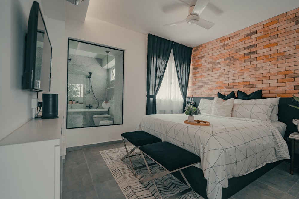 white bed near white wooden framed glass window