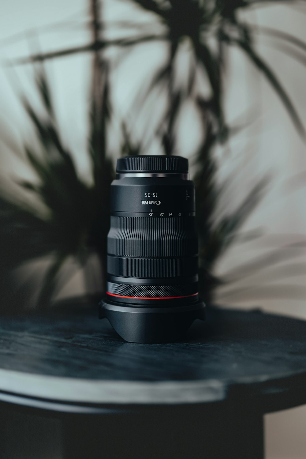 black camera lens on black table