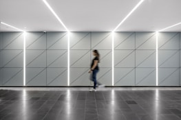 A bright, modern hallway featuring a sleek floor covering from our collection.