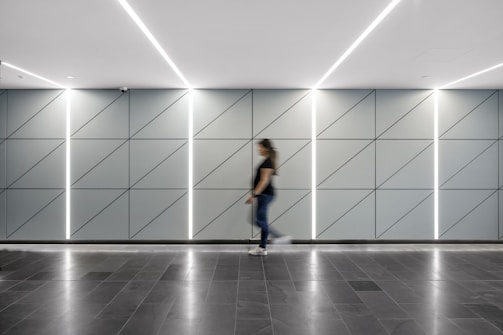 A residential hallway featuring elegant self-leveling epoxy flooring with a subtle designer pattern.