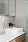 white ceramic sink with faucet