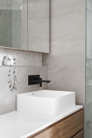 white ceramic sink with faucet
