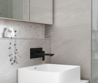 white ceramic sink with faucet