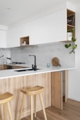 brown wooden chair beside white wooden table
