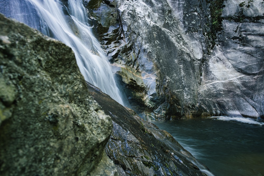 water falls on rocky mountain