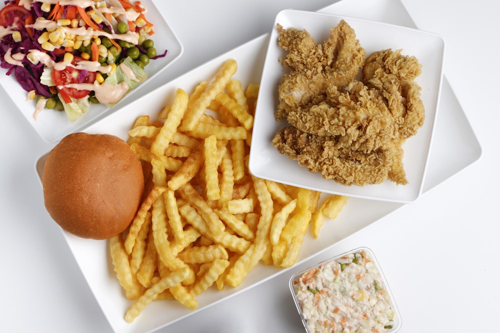 fries and burger on white ceramic plate