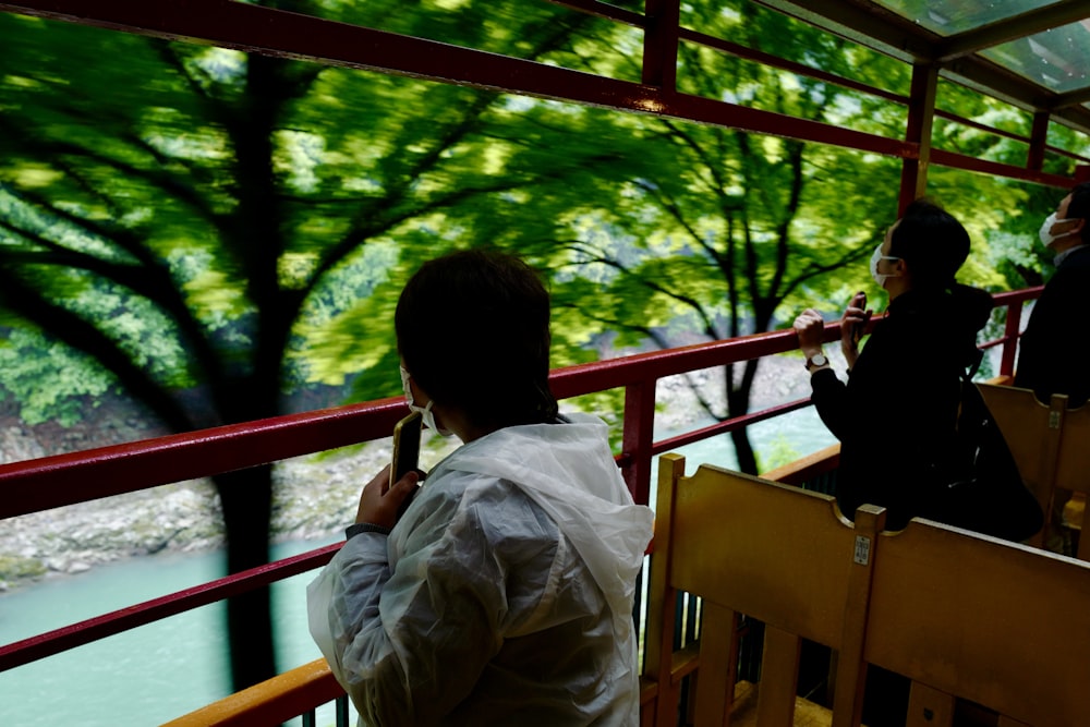 man in white dress shirt sitting on chair