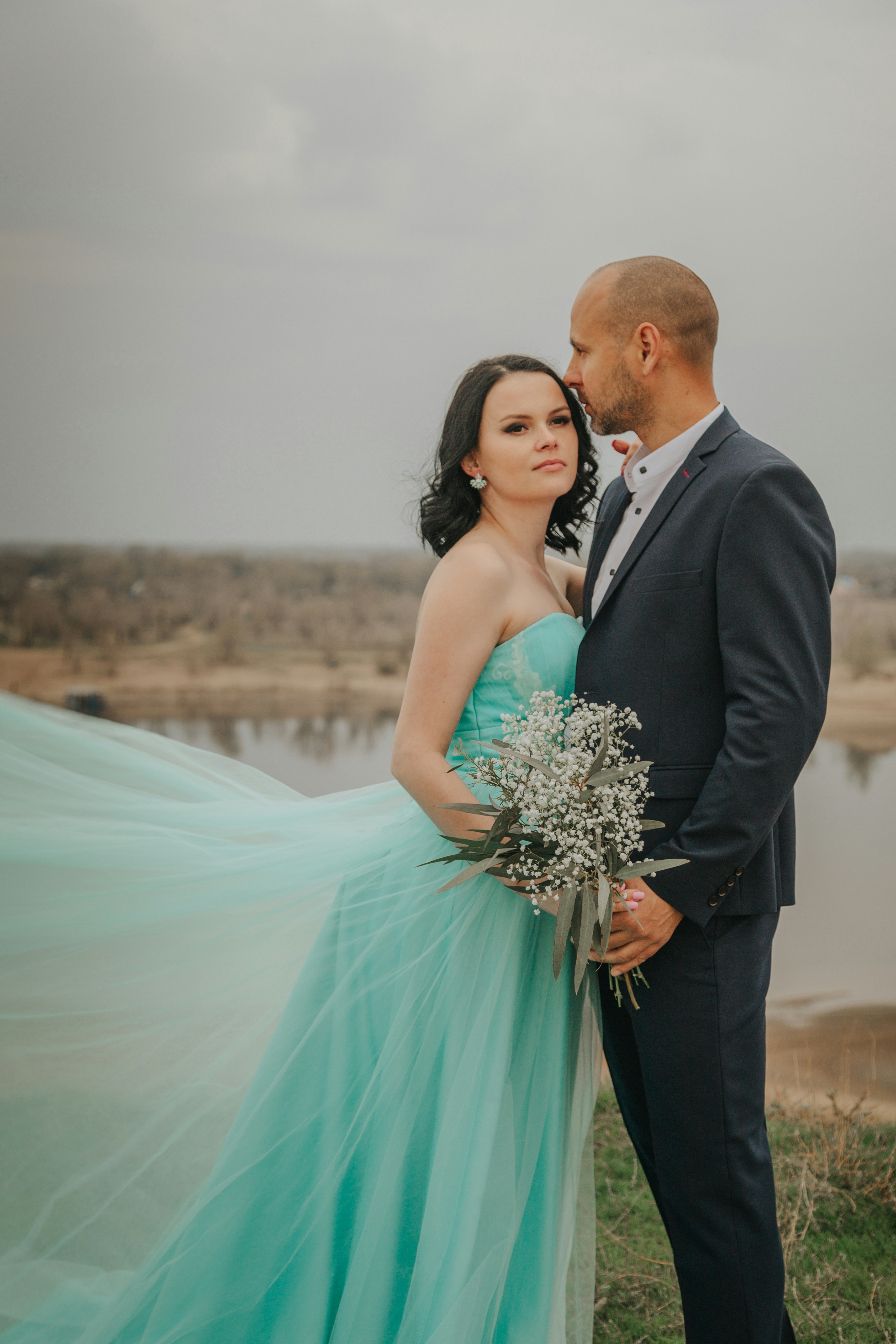 Man in black suit and woman in teal dress photo  Free Grey Image on  Unsplash