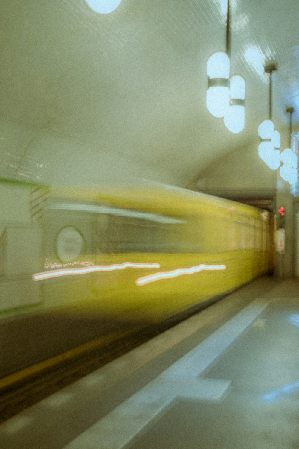 yellow and black train in train station