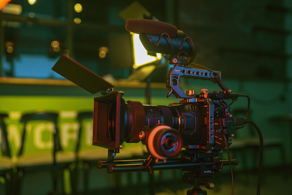 black and red camera on green table