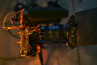 Behind-the-scenes shot of a video production setup with lighting and camera equipment