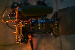 A close-up of a professional camera setup aimed at a hotel suite, highlighting media production in action.