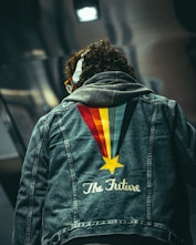 man in black and orange jacket