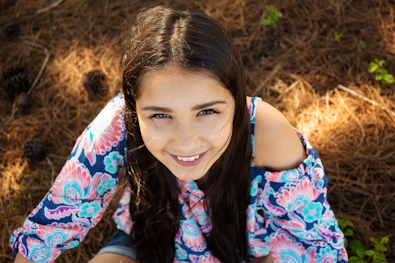 woman in blue white and red floral dress