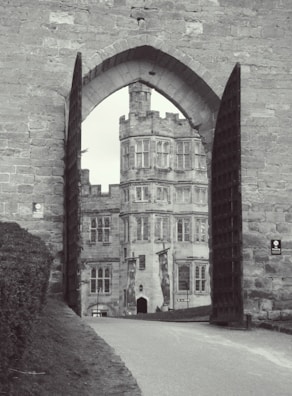The grand entrance of the castle leading to a historical experience.