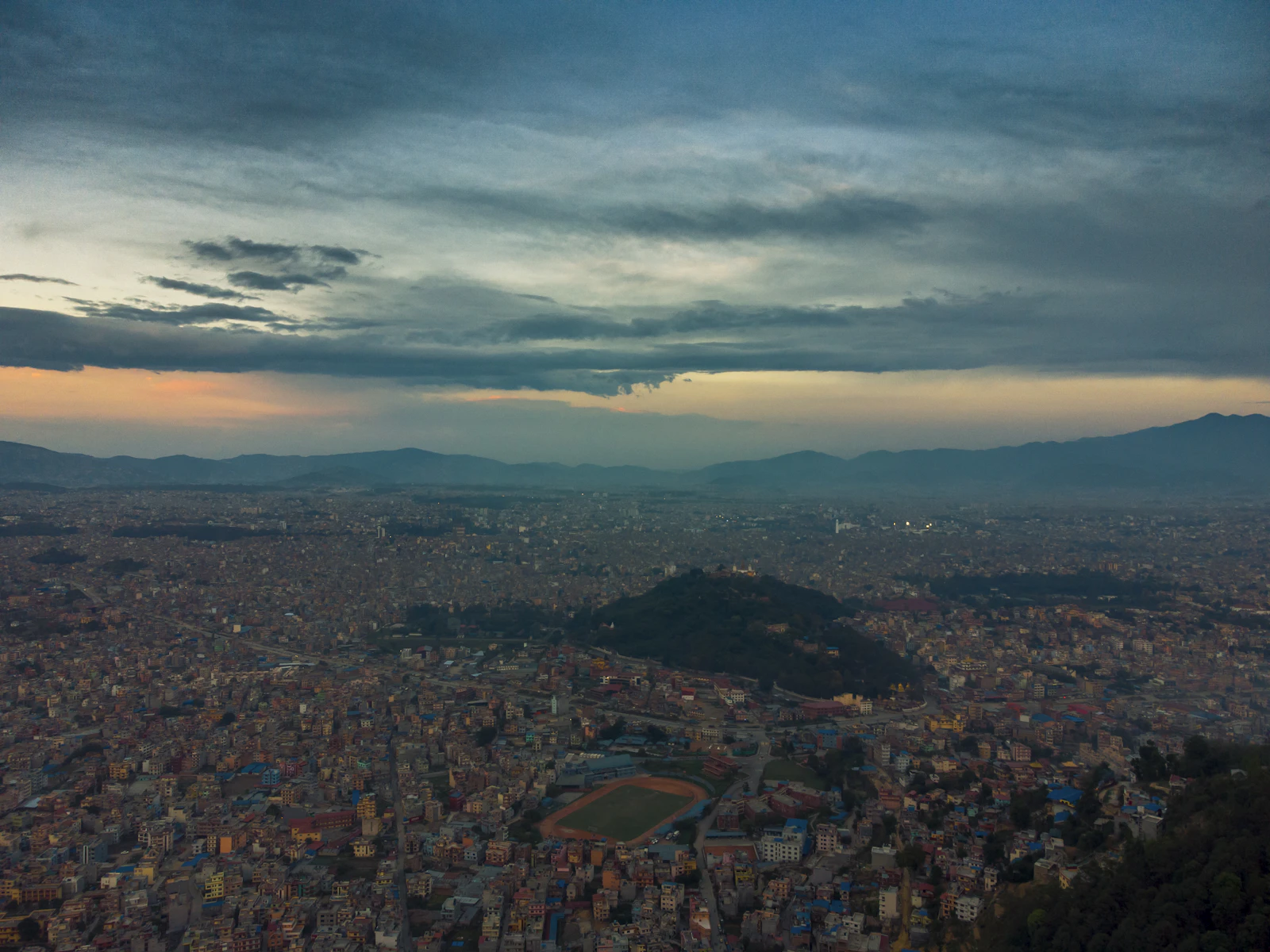 Aerial view of the dense rooftops of the Kathmandu Valley under cloud, Nepal