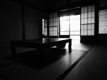 A stylish room featuring Japanese panel curtains with soft diffused light.