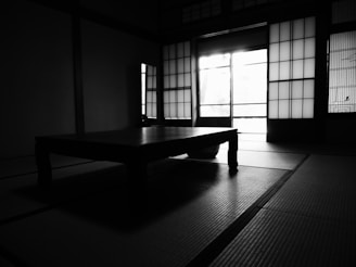 A stylish room featuring Japanese panel curtains with soft diffused light.