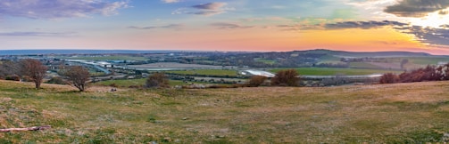 A panoramic view of rolling hills and wooded rural land in upstate South Carolina at sunset.