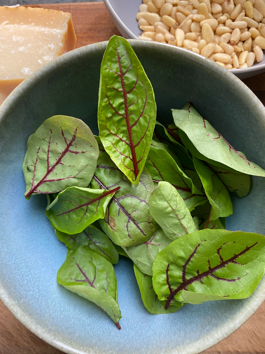 green leaves on blue ceramic bowl