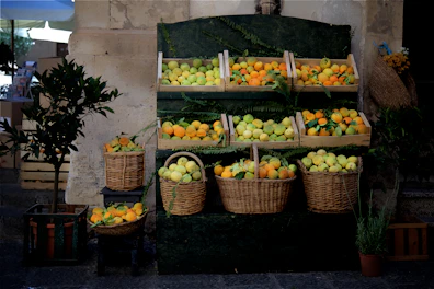 A vibrant display of Brissa cans paired with fresh fruits like oranges and berries on a wooden table.