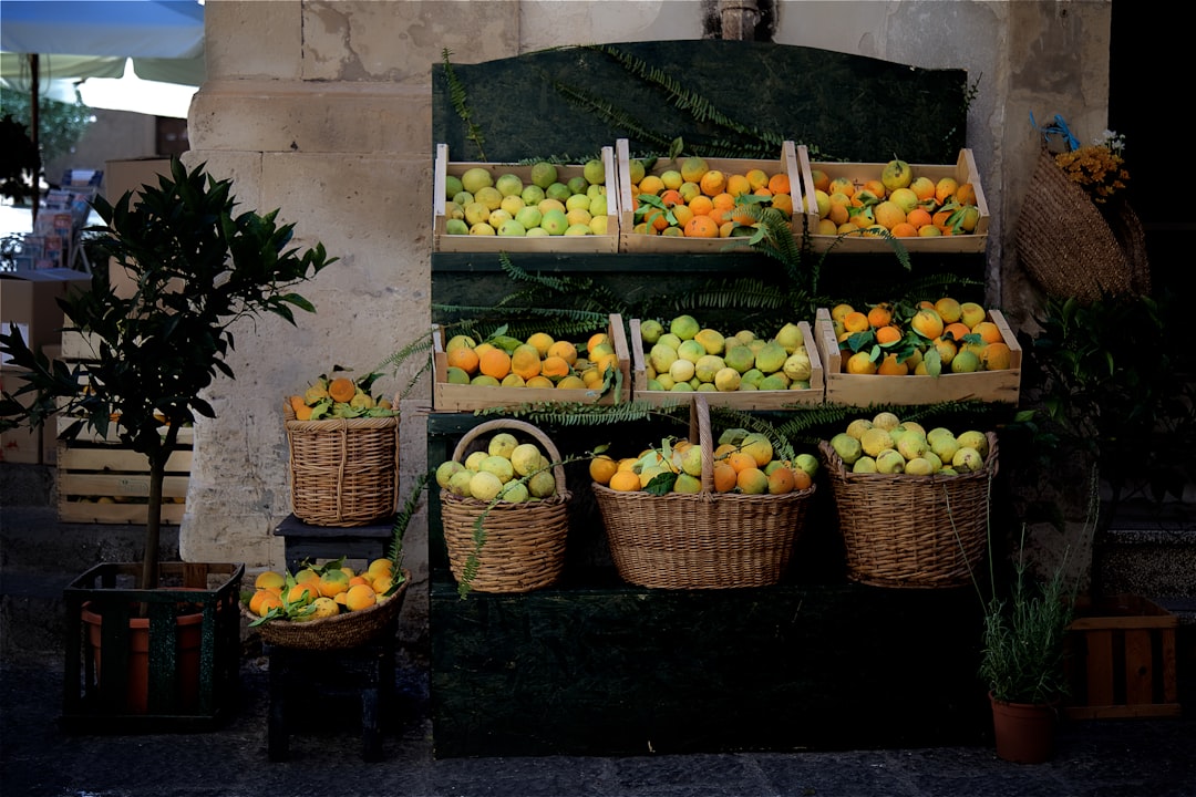 yellow and green fruits on brown woven basket