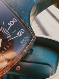 Technician carefully dismantling a car speedometer for recycling.