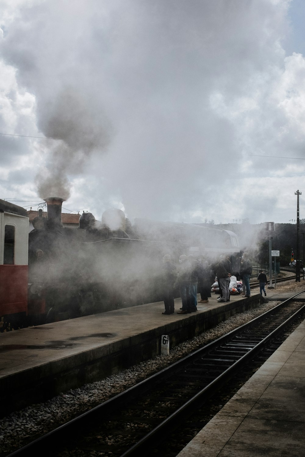 red and white train on rail tracks