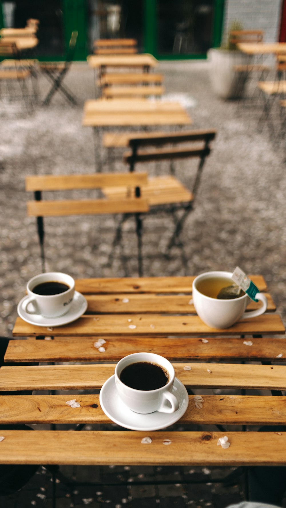 white ceramic mug on brown wooden table