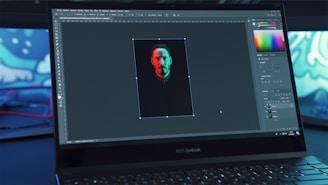 black lenovo laptop computer turned on displaying man in red shirt