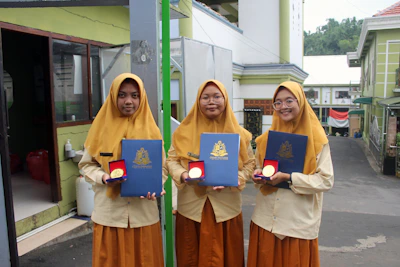 A group of Indonesian journalists engaged in a certification workshop with certificates displayed.