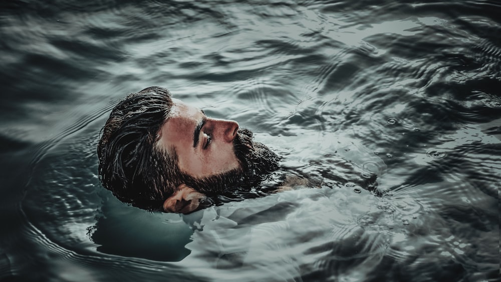 man in water during daytime