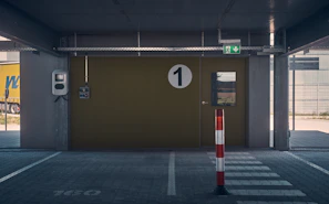 Covered car parking space beside the house with room for one vehicle.