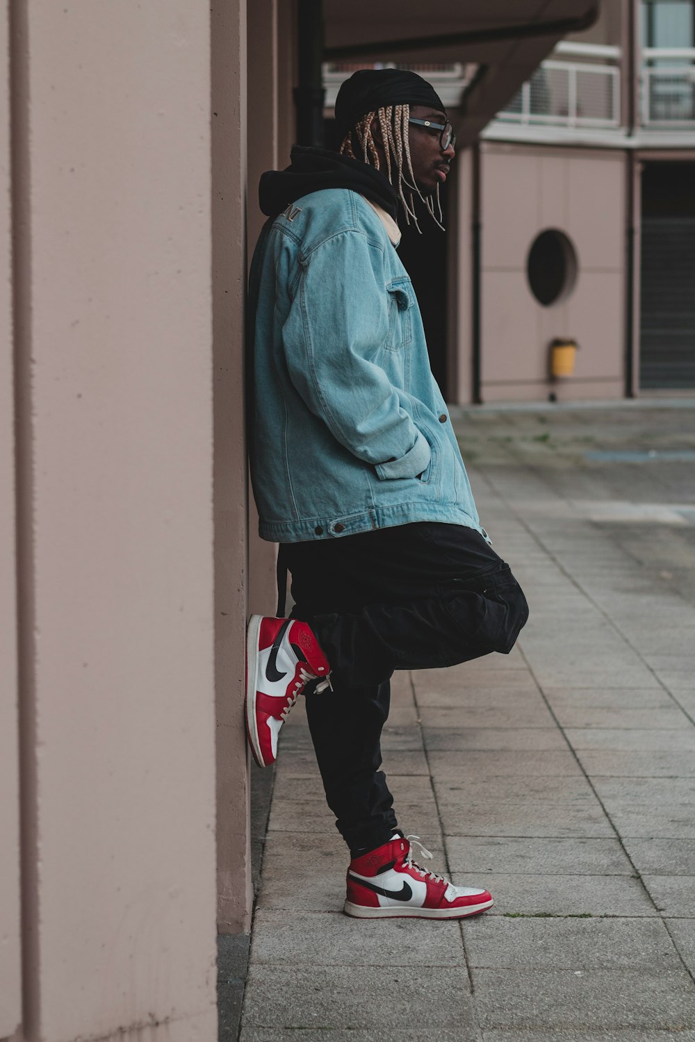 boy in blue hoodie and black pants wearing red shoes photo – Free Men Image  on Unsplash