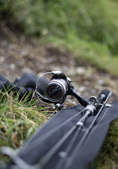 black dslr camera on green grass