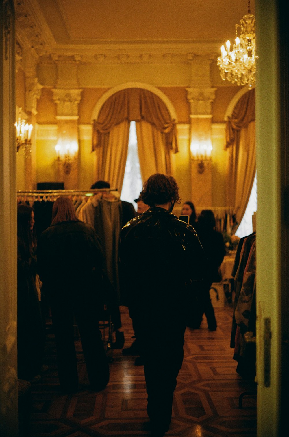 people standing in a hallway