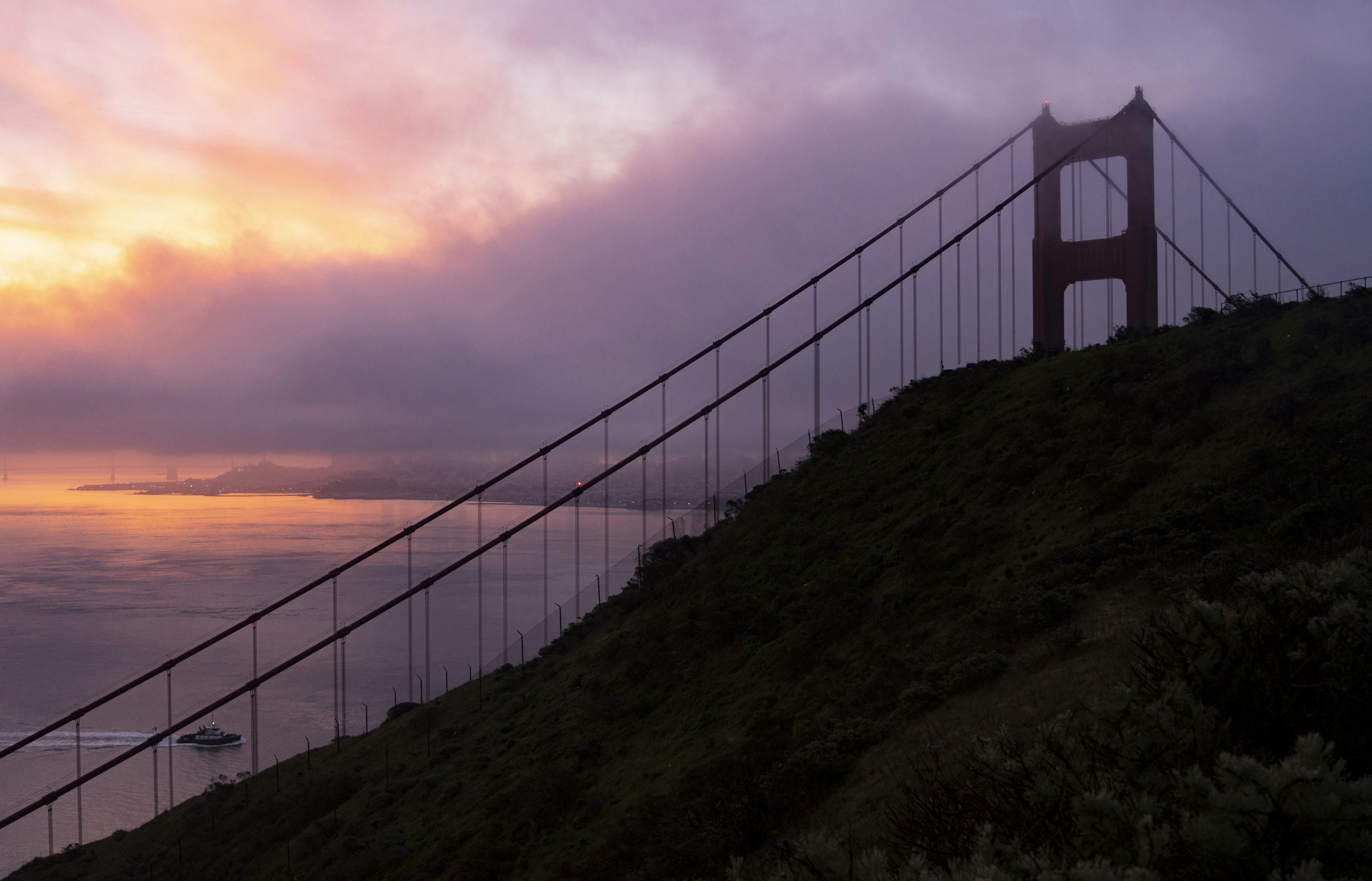 white bridge over the sea during sunset