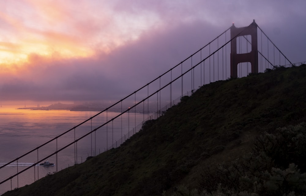 white bridge over the sea during sunset