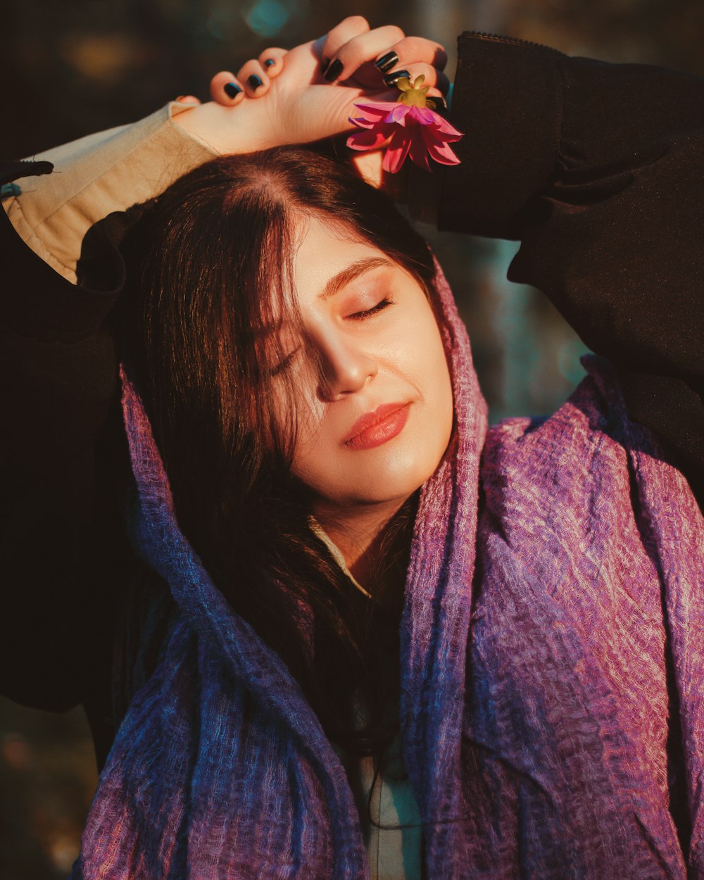 woman in blue scarf and black shirt