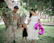 Happy family enjoying a magical day at a Disney theme park with colorful balloons.