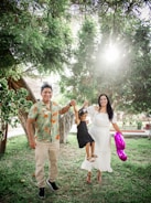 A family enjoying time together in a sunlit park, symbolizing care and connection.