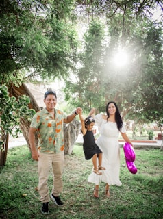 A family enjoying a sunny day at the park wearing sandals.